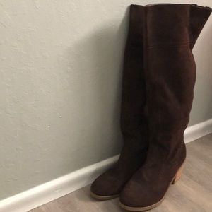 Brown knee high boots.